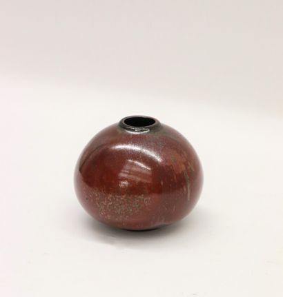 null Glazed ceramic globular vase with a narrow neck and oxblood glazes with metallic...