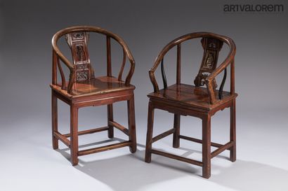 null Two Chinese armchairs in exotic wood, curved armrests and uprights, the vertical...