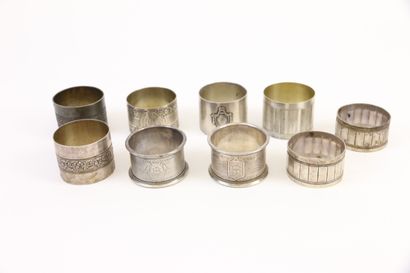 null Lot of nine silver napkin rings with various decorations: friezes of chased...