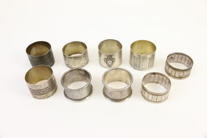 null Lot of nine silver napkin rings with various decorations: friezes of chased...