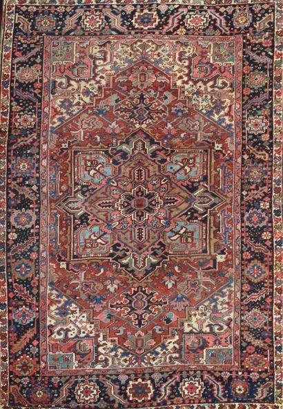  Great Heriz (Iran) Kazak circa 1960. 
Ruby field with large central floral medallion...