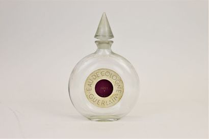 null Guerlain " Jicky " (1889) 

Flacon en verre incolore pressé moulé modèle disque...