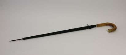 null Scales in carved and engraved wood and inlays. H. : 114 cm. 

An umbrella cane...
