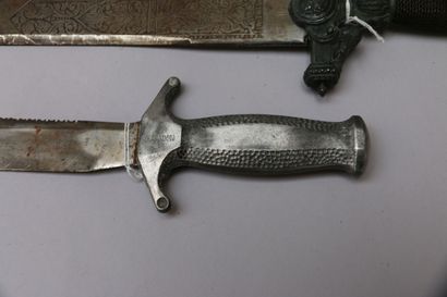 null Lot including :

- A large decorative dagger. Manufacture of Tolde. Engraved...