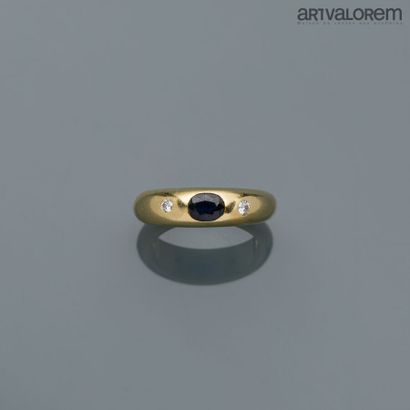 Yellow gold ring centered on a faceted oval...
