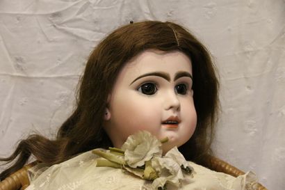 null French doll, with bisque head, open mouth, unmarked, fixed brown eyes, applied...