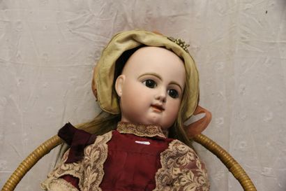 null French doll, with pressed bisque head, closed mouth, marked "R 5 D".

Brown...