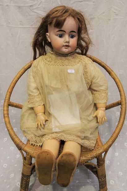 null German doll, with bisque head, open mouth, marked "1011" blue fixed eyes (chips...