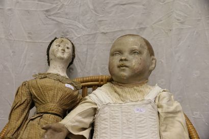 null Two dolls, late 19th/early 20th century, one head bust in paper mache, old dress,...