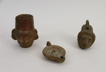 A terracotta woman's face in the pre-Columbian...