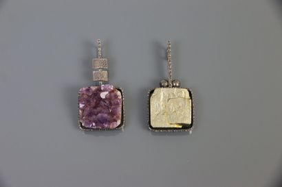 null AHB circa 1970

Two silver pendants 800°/°° hammered, one decorated with an...