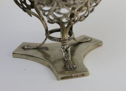 null Tripod cup out of silver plated metal resting on feet claws, mounting openwork...