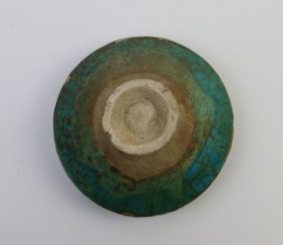 null IRAN, 12th century

Bowl on pedestal in turquoise glazed siliceous ceramic,...