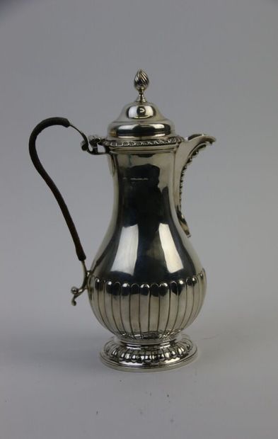 null Silver coffee pot, handle covered with leather, decorated with gadroons and...