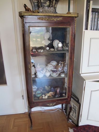 null Wood veneer display cabinet, opening to a glass door, curved base, top of breccia...