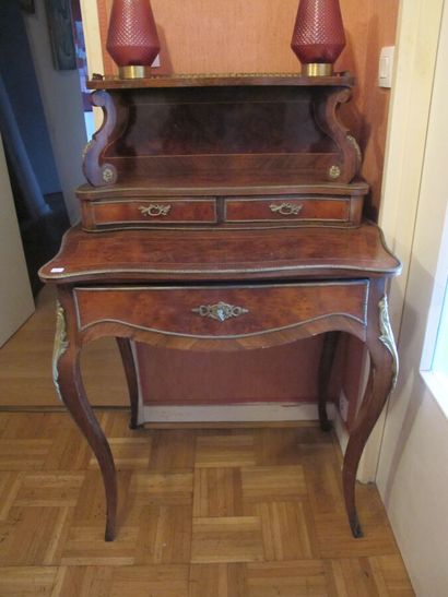 null Lady's desk with steps, burr walnut and rosewood veneer, opening to a drawer...