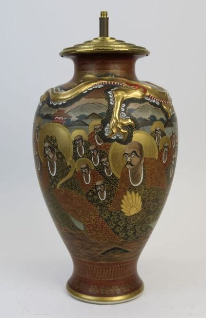 null JAPAN, Satsuma, 20th century 

Porcelain baluster vase with enameled and gold...
