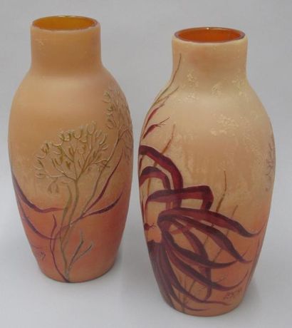 Legras Paire de vases ovoïdes à col droit en pate de verre orangée à décor de feuillages....