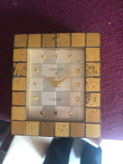 null LOOPING

Alarm clock in gilded metal with cubes decoration, dial signed and...