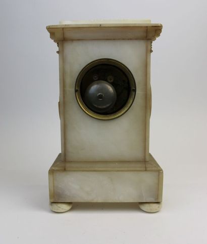 null Alabaster clock, with carved decoration of flowers and garlands of flowers on...