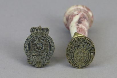 null Two wax seals in bronze, of which : 

- one depicting the arms of King Ferdinand...