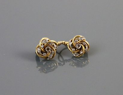 null Pair of yellow and white gold twisted sleepers forming a flower, each adorned...