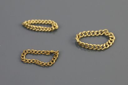 null Three rings in yellow gold 750°/°° in mesh. 

Weight : 6,9 g