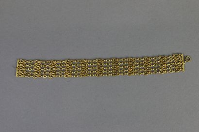 null Bracelet composé de cinq rangs de chaîne fantaisie en or jaune 750°/°°, fermoir...