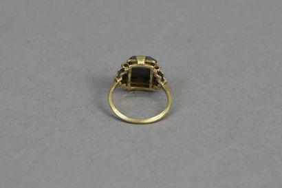 null Yellow gold ring centered on a rectangular marcasite in a setting of tiered...