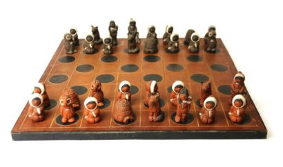 Chess game. Terracotta pieces representing...