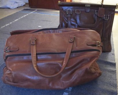 THE BAGGAGE
2 large brown leather travel...