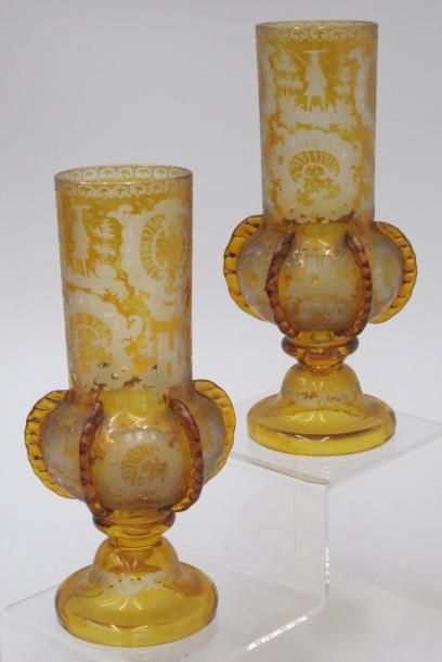 Deux vases en verre teinté oranger, gravé,...