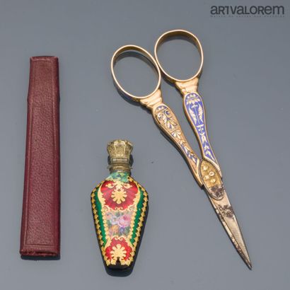 A pair of gold scissors with steel blades...