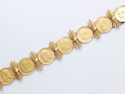 null Bracelet en or 18 K, composé d'une suite de 7 pièces anglaises agrémentées de...