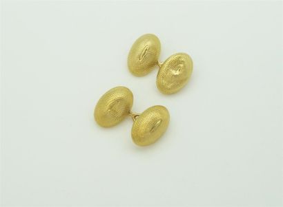 null Paire de boutons de manchettes en or jaune 18k de forme ovale à motif amati....