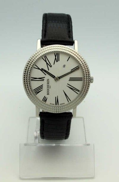 null BOUCHERON. Montre bracelet en acier, cadran argenté avec chiffres romains, affichage...