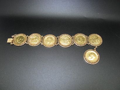 null Bracelet en or jaune 18K (750°/00) orné de sept souverains or datés entre 1907...
