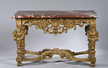 null Table-console de forme rectangulaire en bois sculpté et doré à décor de coquille...