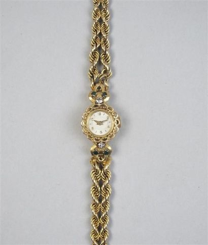 null Petite montre ronde de femme en or jaune 750°/°° (18K) et platine, bracelet...