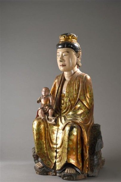 null Quan Âm Thi Kinh, la déesse protectrice des enfants. Statue sculptée dans un...