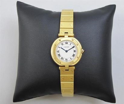 null CARTIER. Modèle SANTOS. Montre bracelet de dame ronde en or jaune (750°/°°)...