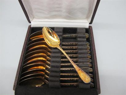 Douze cuillères à moka en argent (950°/°°) vermeillé, la spatule à décor de Bacchus...