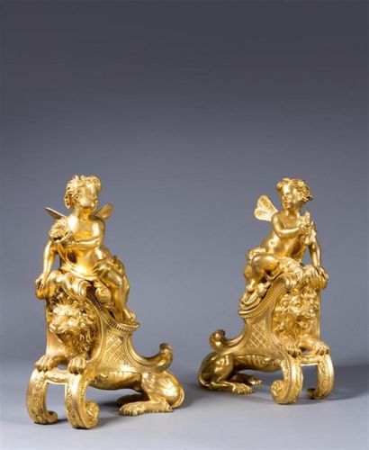  Henry DASSON (1825-1896). Paire de chenets en bronze ciselé et doré à décor de putti... Gazette Drouot