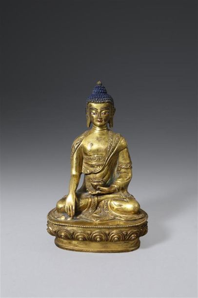 null CHINE
Statuette en bronze doré et rehauts de polychromie, figurant le Bouddha...