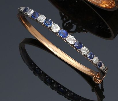 null Bracelet jonc articulé en or jaune 750°/°° (18k) et argent orné de diamants...