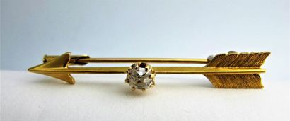 null Broche en or jaune 750°/°° (18k) en forme de flèche orné d'un diamant taille...