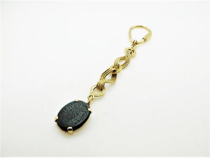 null Articulated key ring in 750 °/°°° yellow gold holding an oval plate in blood...