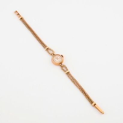 MOVADO 

Montre bracelet de dame en or jaune (750) 

Boîtier rond, lunette à décor...