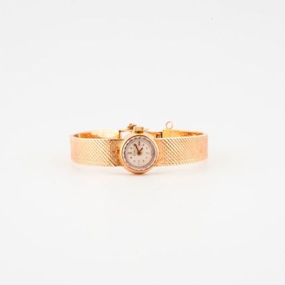 ESKA 

Montre bracelet de dame en or jaune (750).

Boîtier rond.

Cadran à fond crème,...