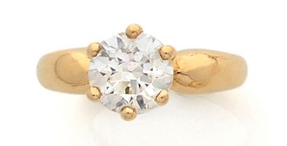 null Bague jonc solitaire en or jaune (750) ornée d'un diamant demi-taille en serti...
